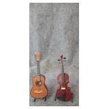 Pair of small plastic musical replica instruments