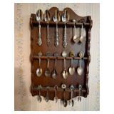 Vintage souvenir spoons and wooden rack