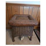 Peeled rattan wicker end table stored in garage