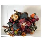 Natural wood base faux fruit centerpiece