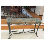 Vintage heavy iron console table with a glass top