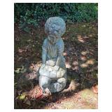 Boy on turtle garden statue fountain