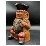 Vintage pitcher depicting an innkeeper