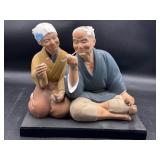 Vintage Japanese couple smoking on plastic base