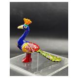 metal peacock featuring colorful Meenakari art
