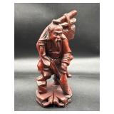 vintage Asian statue is hand-carved