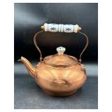 Blue and white handled copper tone teapot