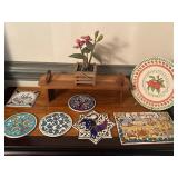 Assorted trivets, faux flowers and more