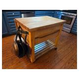Rolling butcher block kitchen island and pans
