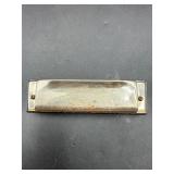 The American Ace Hohner harmonica