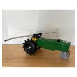 John Deere traveling lawn sprinkler tractor