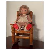 vintage Eugene doll On wooden rocking chair