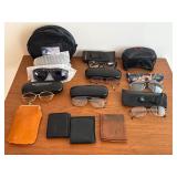 Assorted glasses wallets cigarette case