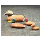 four vintage miniature wooden duck decoys