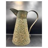 embossed metal pitcher
