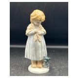 porcelain figurine young girl wearing a shawl