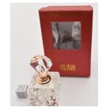Bouteille de parfum Oleg Cassini, signï¿½e, en