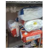 Stack of various sizes adult diapers