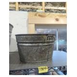 Small 3 gallon galvanized wash tub has grease all
