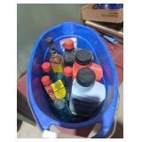 Bucket with gum out fuel treatment oil, diesel