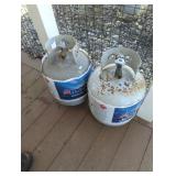 Two propane grill tanks, one full one empty No