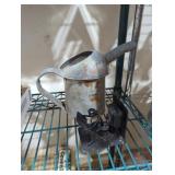 Metal sculpture & antique water oiler can