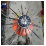 Retro style wall clock. Some fins have damage