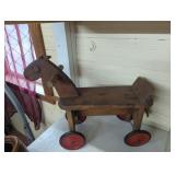 Early wooden childs ride on toy