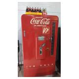 Coca-Cola machine 1950's including soda bottles