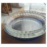 Stack of vintage pie pans, Pyrex, etc