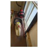 Two Craftsman electric hedge trimmers