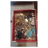 Flat of vintage costume jewelry
