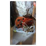 Tote full of extension cords, power strips