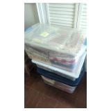 Stack of three totes full of linens