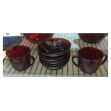 Ruby red glass sugar, creamer and small bowls.