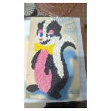 Melted plastic popcorn skunk decoration on
