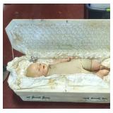 Child's casket with baby doll can be used for