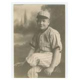 Boy in Pinstriped Baseball Uniform Photo