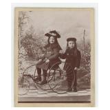 Children on Tricycle Cabinet Photo