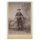 Young Man with Safety Bicycle Cabinet Photo