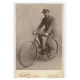 Mustached Englishman on Bicycle Cabinet Photo