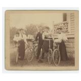 Family on Wood Rim Bicycles Cabinet Photo