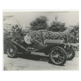 Man in Early Roadster Race Car Photo