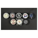 Collection of NHL and Olympic Hockey Pucks