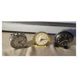 Three vintage alarm clocks
