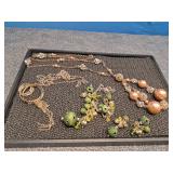 3 Necklaces and one has matching earrings