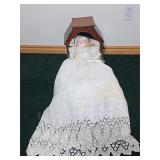 Antique Porcelain Doll in Wooden Cradle