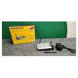 Two Net Gear Wireless Routers, One New in Box