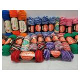 Red heart assorted colored rolls of string/yarn