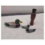 Vintage wooden duck figurines and duck call